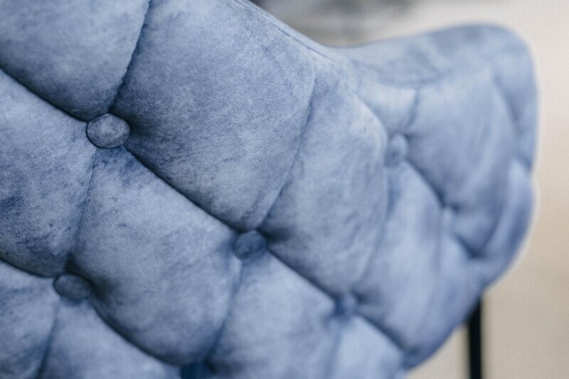 Freischwingerstuhl in pastellblau Stoffbezug Detailansicht