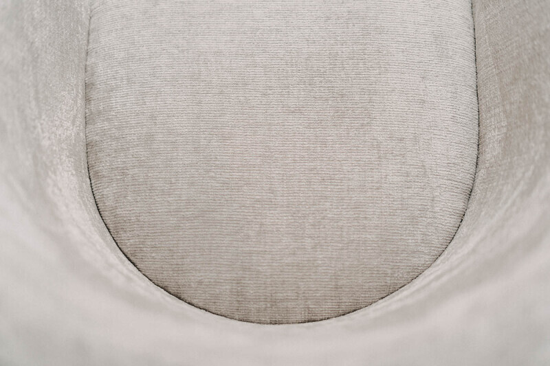 Detailfoto Schalenstuhl Sitzfläche Stoffbezug